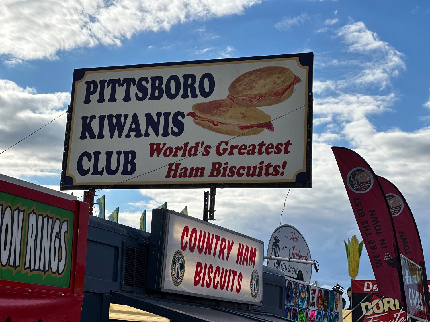 The Pittsboro Kiwanis Club sign for their famous ham biscuits at the N.C. State Fair in Raleigh on Oct. 16, 2023.